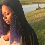 Black woman with a vintage hoodie