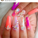 coffin shaped peachy purple nail design